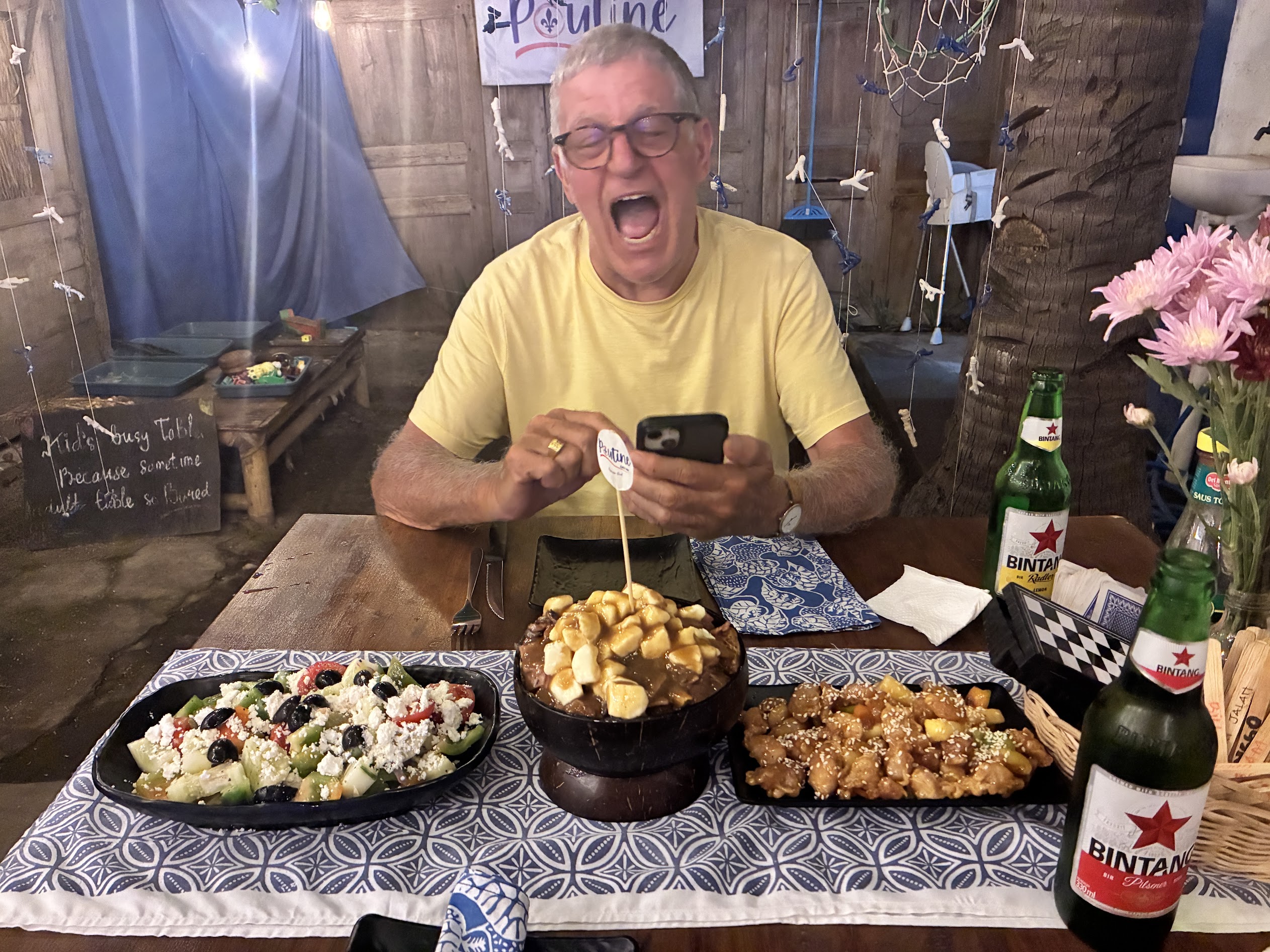 Guest review photo with a fun table moment at Poutine Gili Air